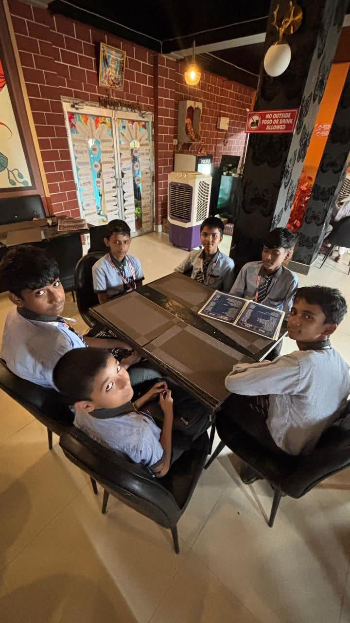 Students discussing at desk